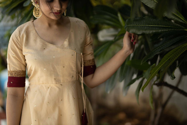 Kayalvizhi Cream and Maroon