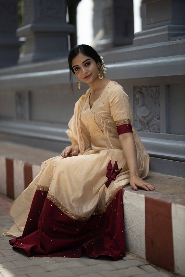 Kayalvizhi Cream and Maroon