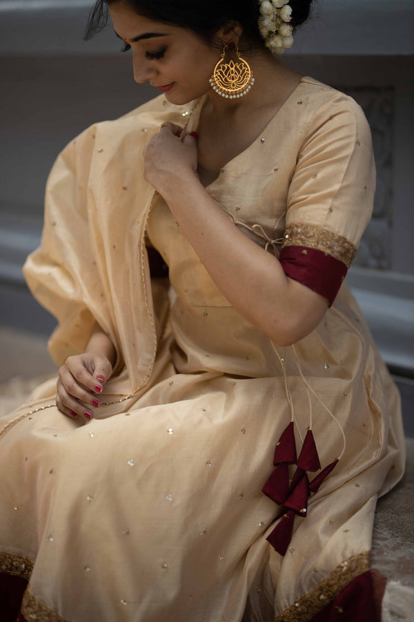 Kayalvizhi Cream and Maroon
